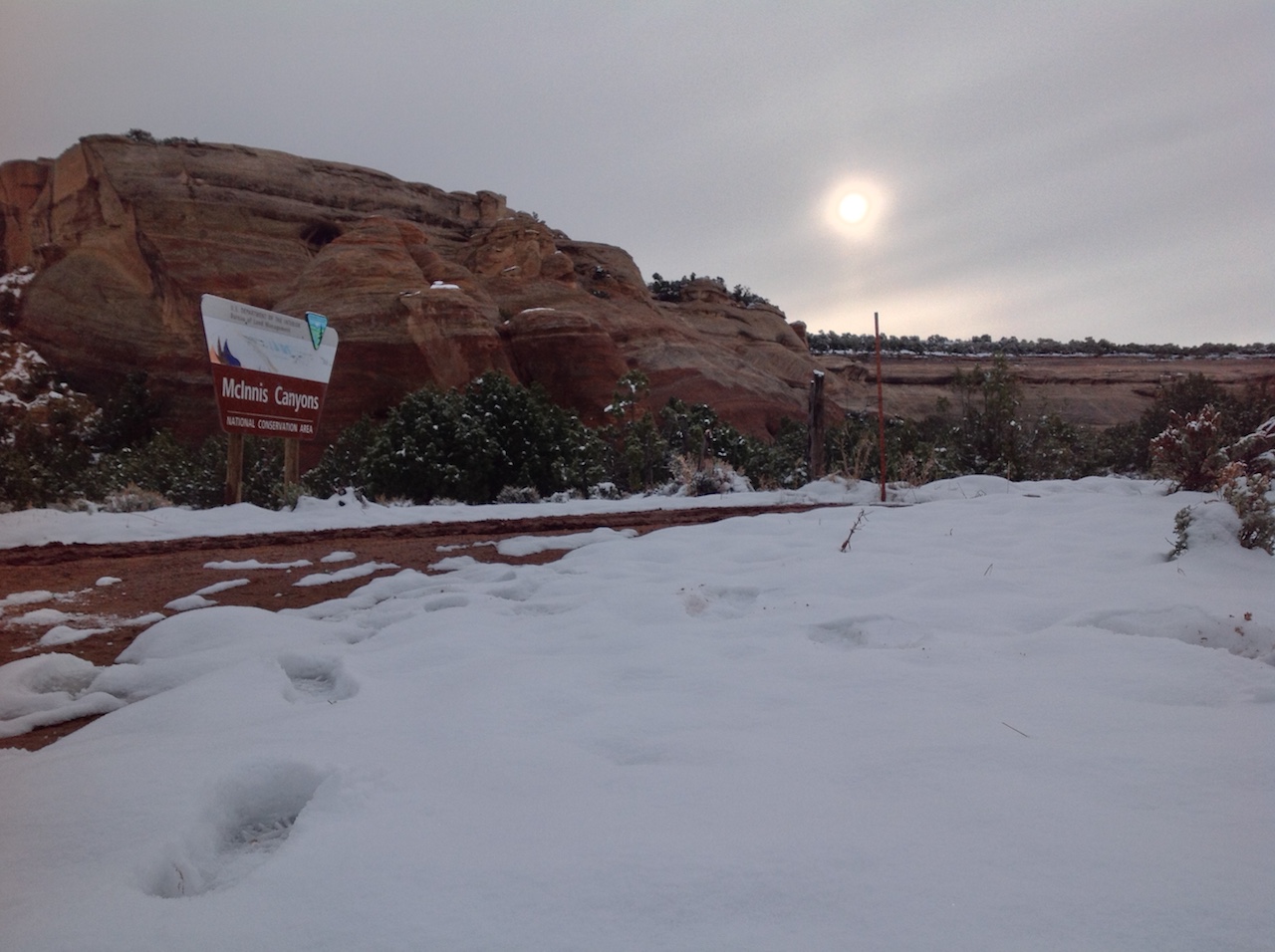 mcinnis-canyons-sign-snow-winter-backpacking-camping-morning-2