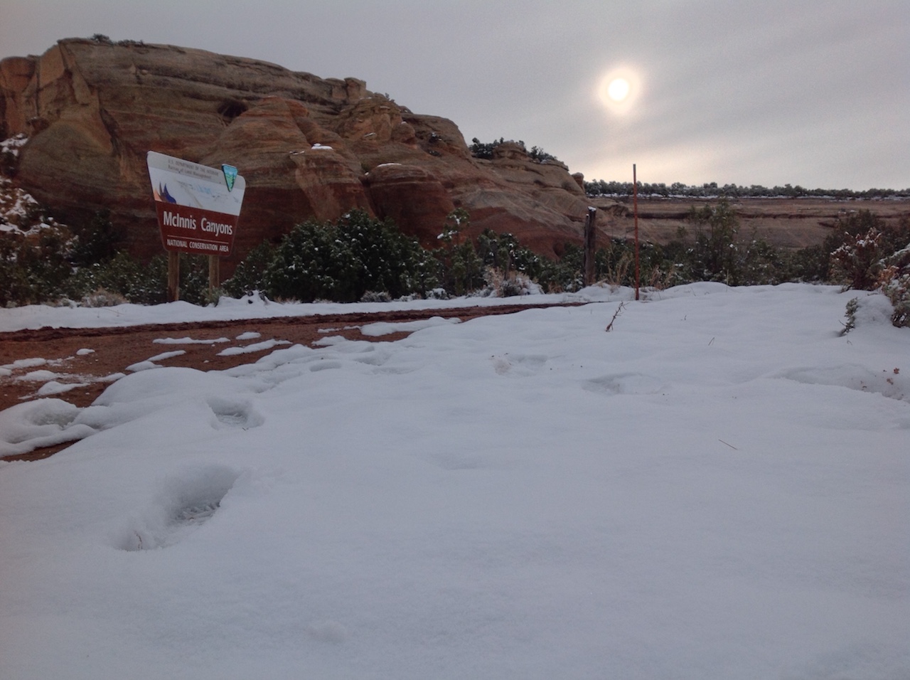 mcinnis-canyons-sign-snow-winter-backpacking-camping-morning